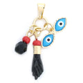 14K GOLD PLATED PENDANT WITH 2 BLUE ENAMEL EVIL EYES AND A BLACK POWER FIST M553