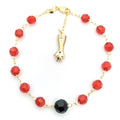 14K GOLD PLATED 7.5" BRACELET W/ RED & BLACK FACETED BEADS & FIST DANGLE M563