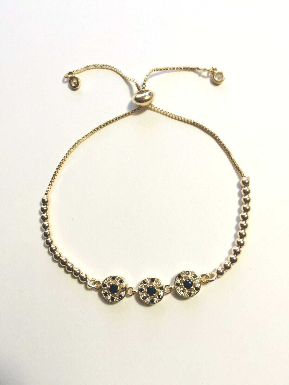 14K GOLD PLATED 7-11" BOLO BRACELET WITH 3 CIRCLES AND WHITE AND BLACK CZ M193