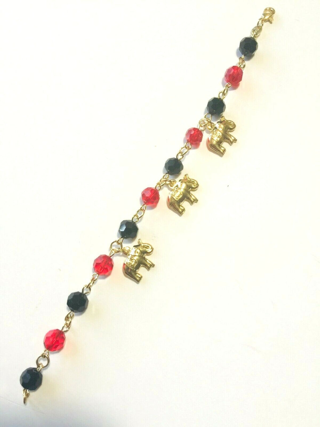 14K GOLD PLATED 7" BRACELET W/7MM BLACK & RED BEADS & 3 ELEPHANTS DANGLING M225