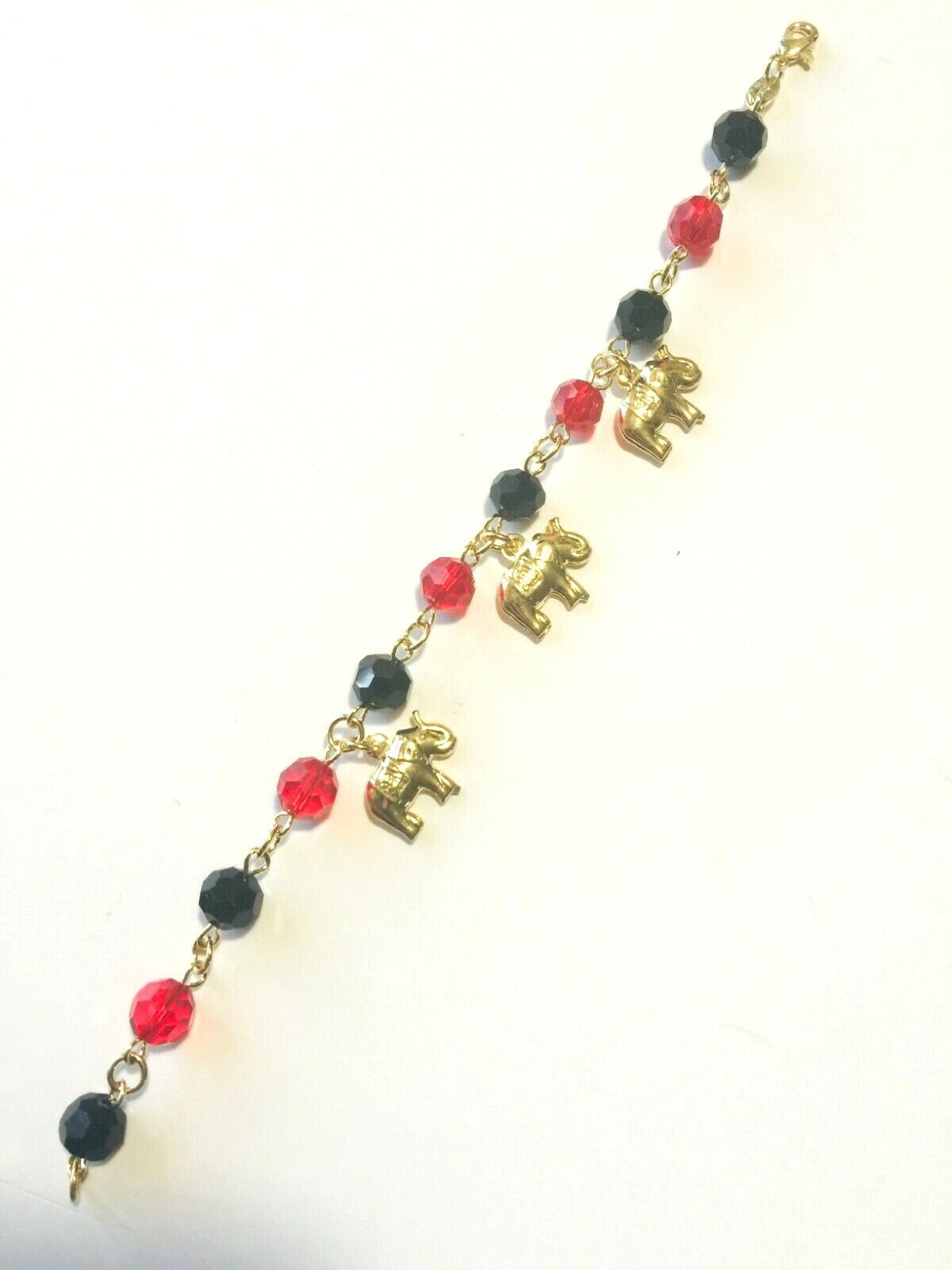 14K GOLD PLATED 7" BRACELET W/7MM BLACK & RED BEADS & 3 ELEPHANTS DANGLING M225